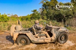 This Ho Chi Minh Trail Jeep Tour is a 7-day guided Vietnam adventure from Hanoi to Hoi An, traveling in a vintage US Army Jeep MUTT M151A2 along one of the country’s most historic routes. The journey follows the legendary Ho Chi Minh Trail through mountain roads, national parks, war sites, and quiet countryside, with highlights including Phong Nha National Park, Dong Loc, the DMZ, Khe Sanh, Vinh Moc Tunnels, Hue, and Hai Van Pass. Designed for travelers who want comfort, history, and authentic scenery without riding a motorbike, this is one of the most complete Vietnam Jeep tours on the website.
